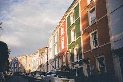 A cozy British street lined with colorful houses under a soft morning light