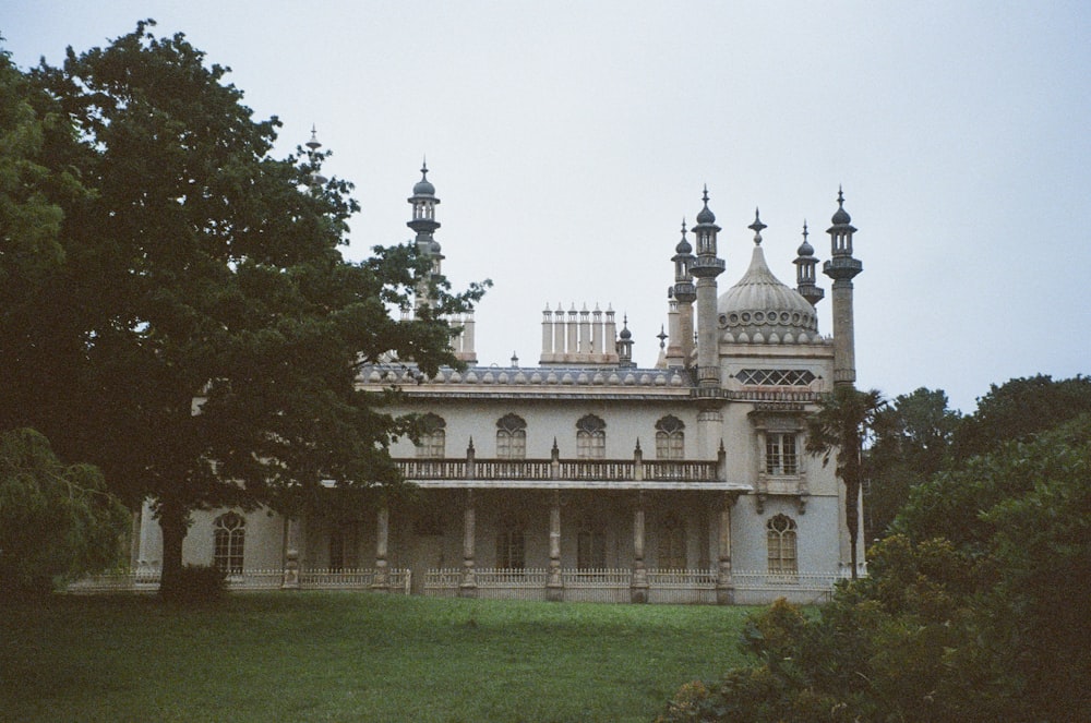 a large white building with many windows and towers