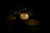 Close-up of intricate Indian jewelry pieces sparkling under soft light.