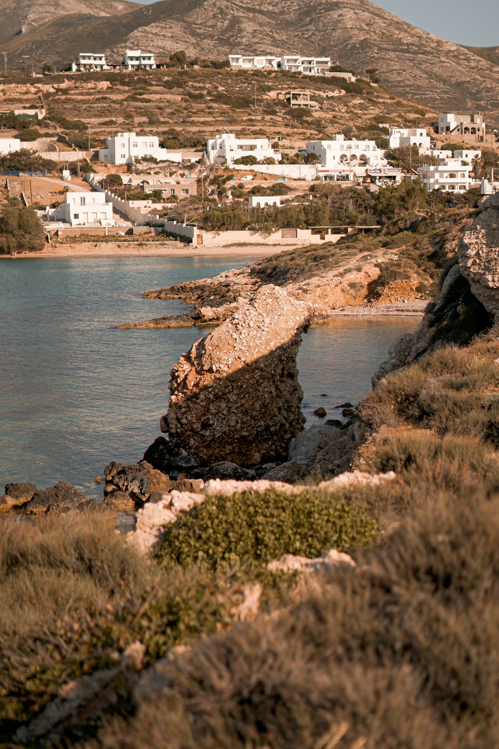 a view of a body of water with a town in the background