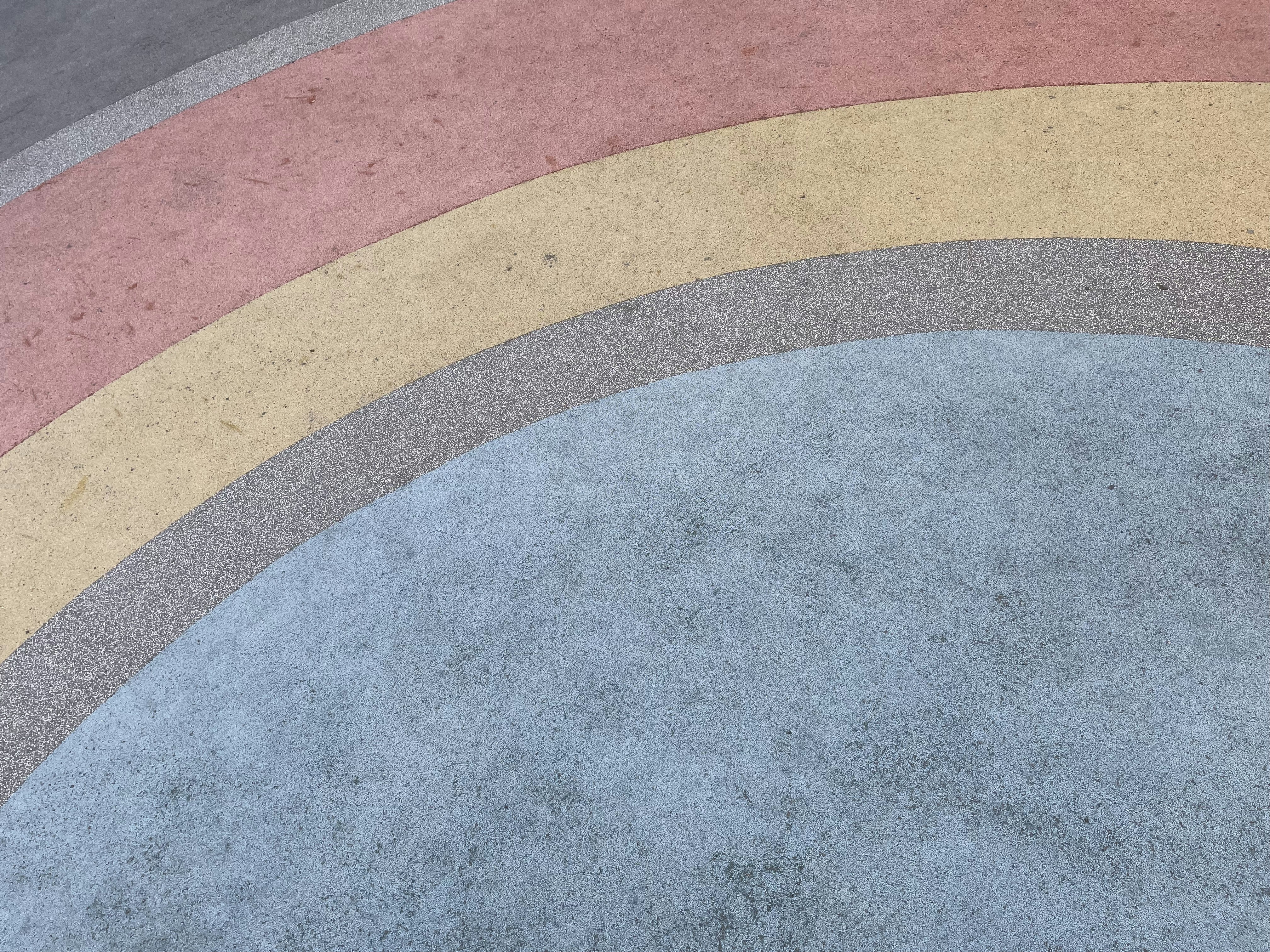 a skateboarder in a black jacket is doing a trick