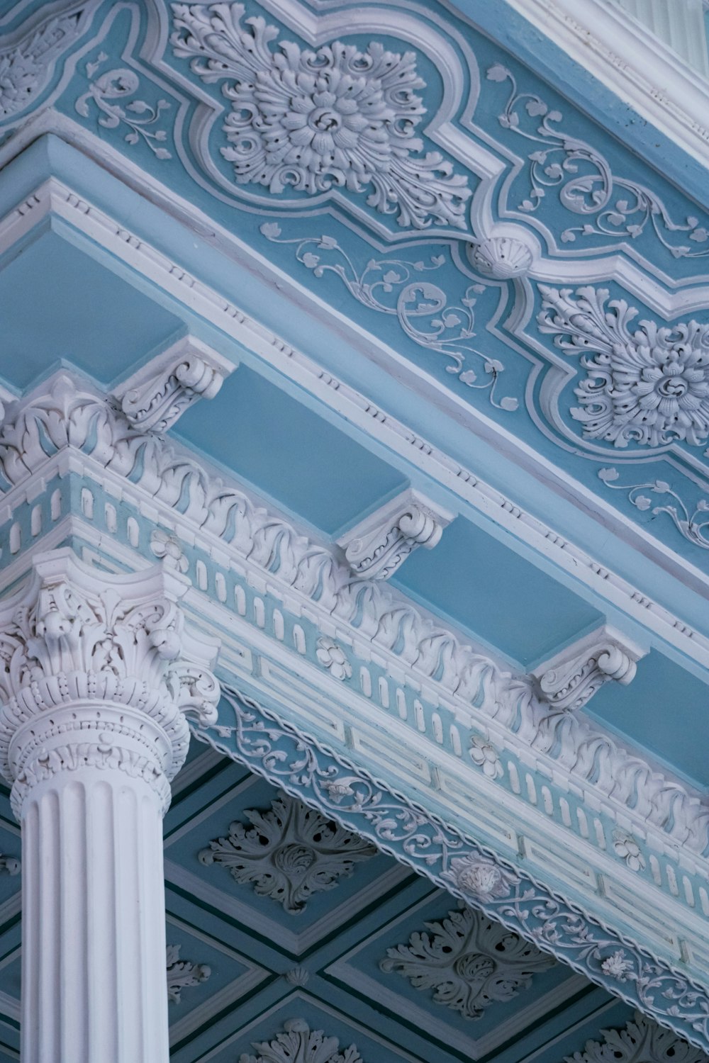 a close up of a blue and white painted ceiling