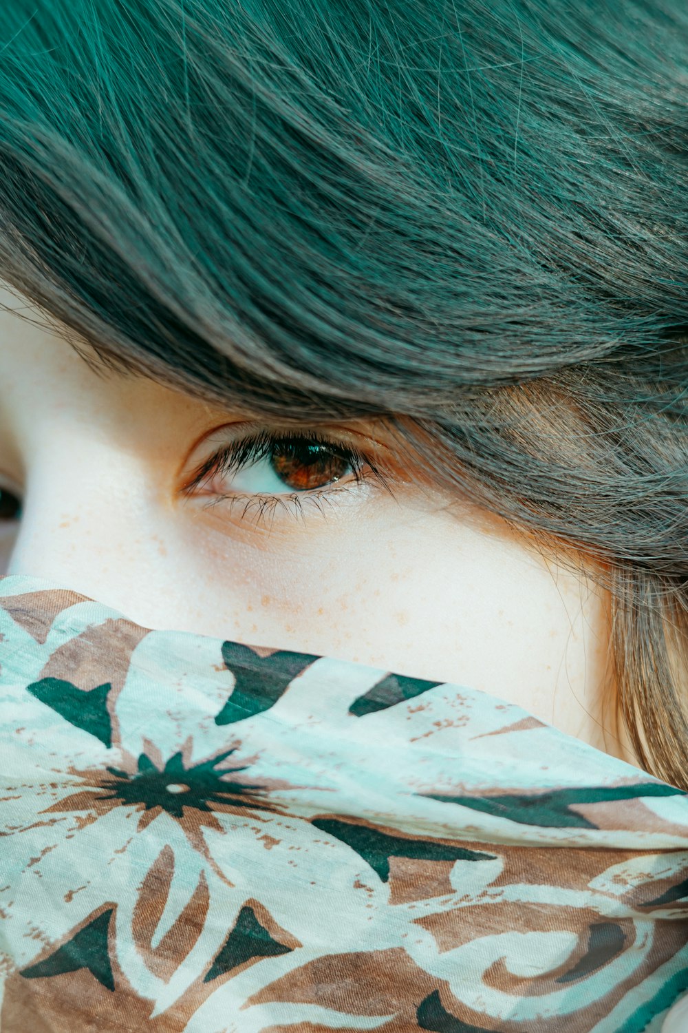 a close up of a person with green hair