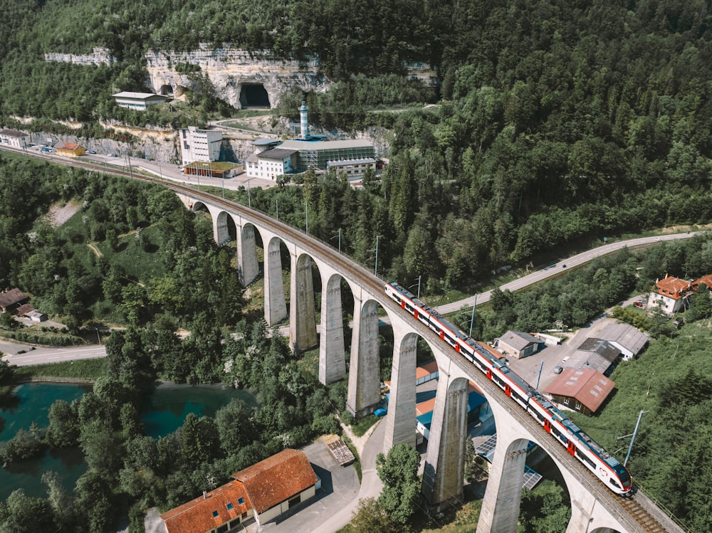 a train traveling over a bridge over a river