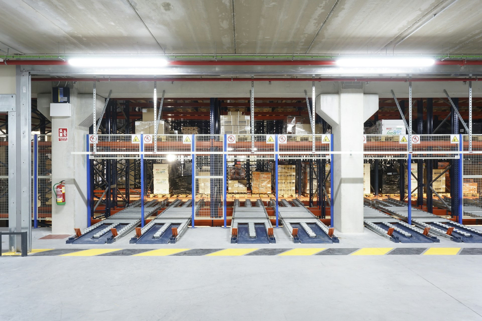 a warehouse filled with lots of metal racks