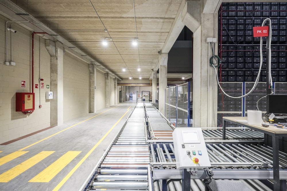 a long hallway with a lot of machines on the side of it