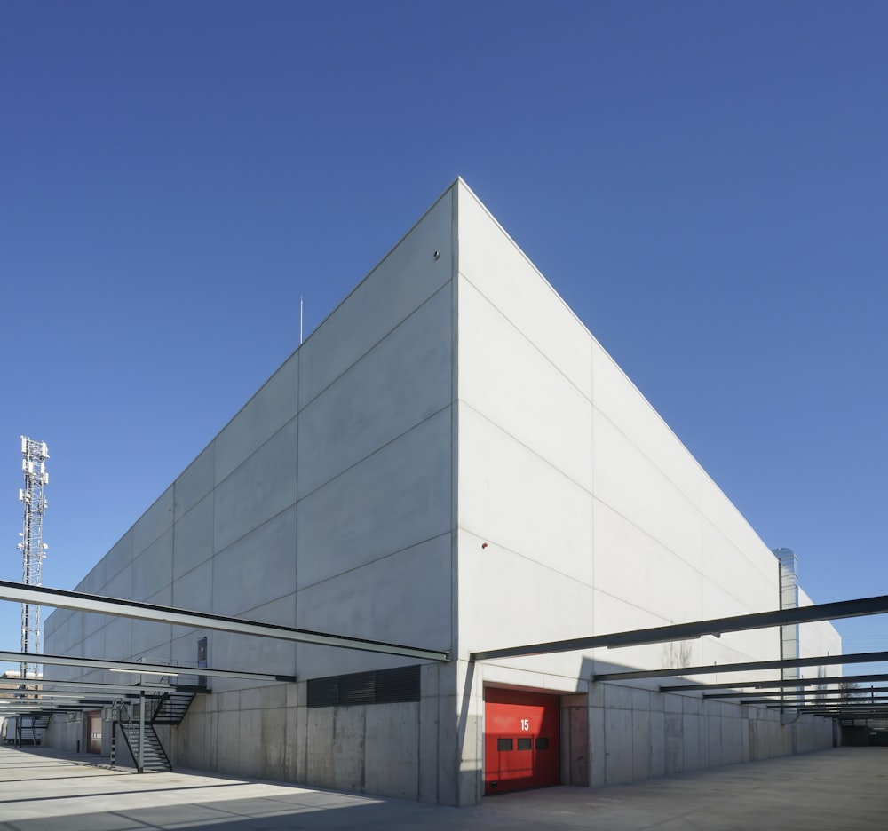 a large white building with a red door