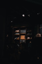 A friendly team member carefully sorting items in a cozy, sunlit living room.