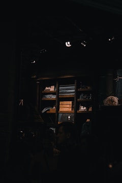Friendly volunteers organizing donated clothes in a bright room.