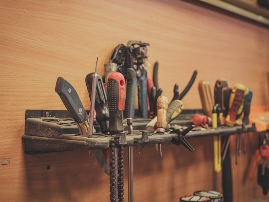a bunch of tools that are on a shelf
