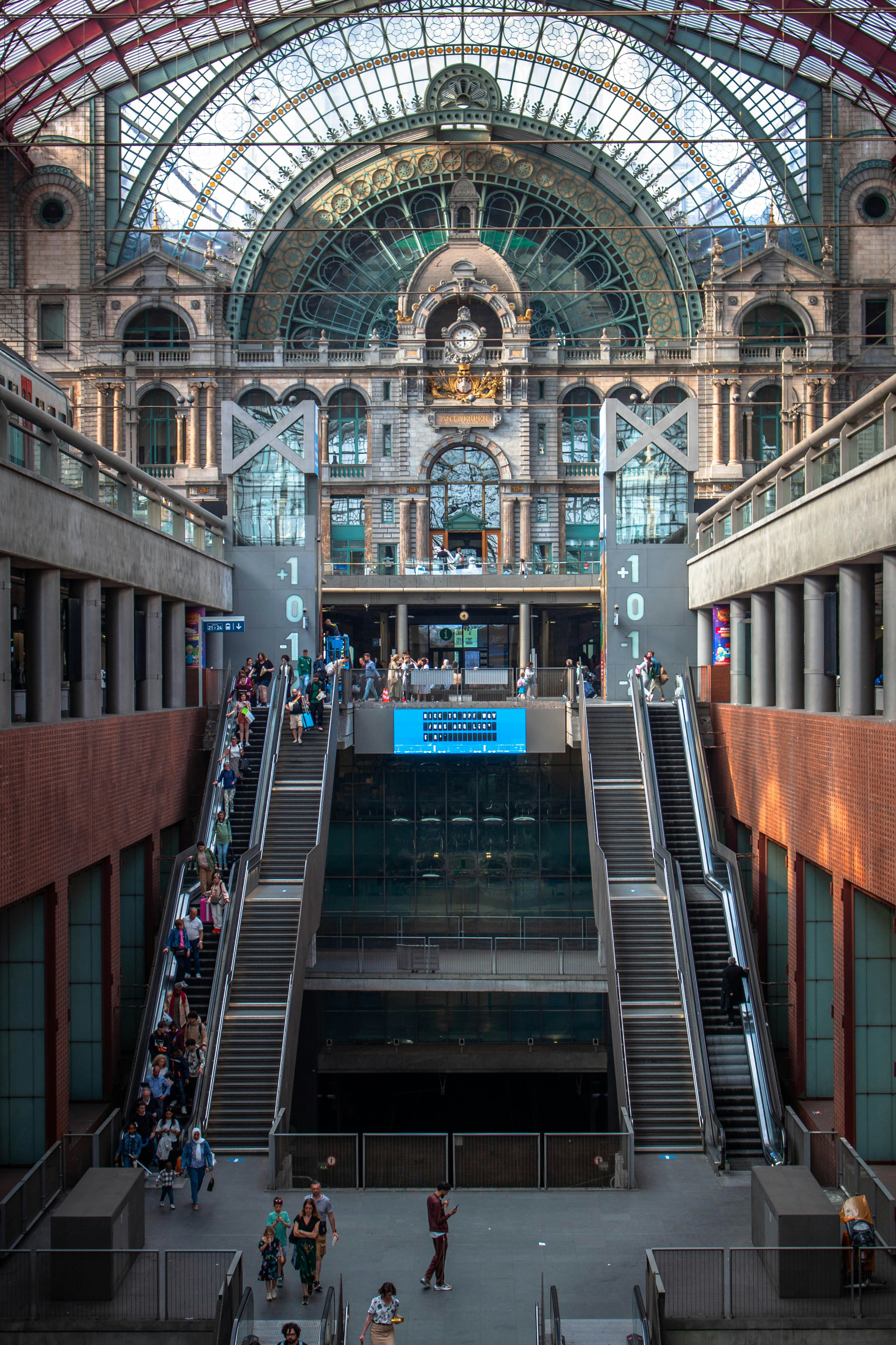 a group of people walking up and down a set of stairs