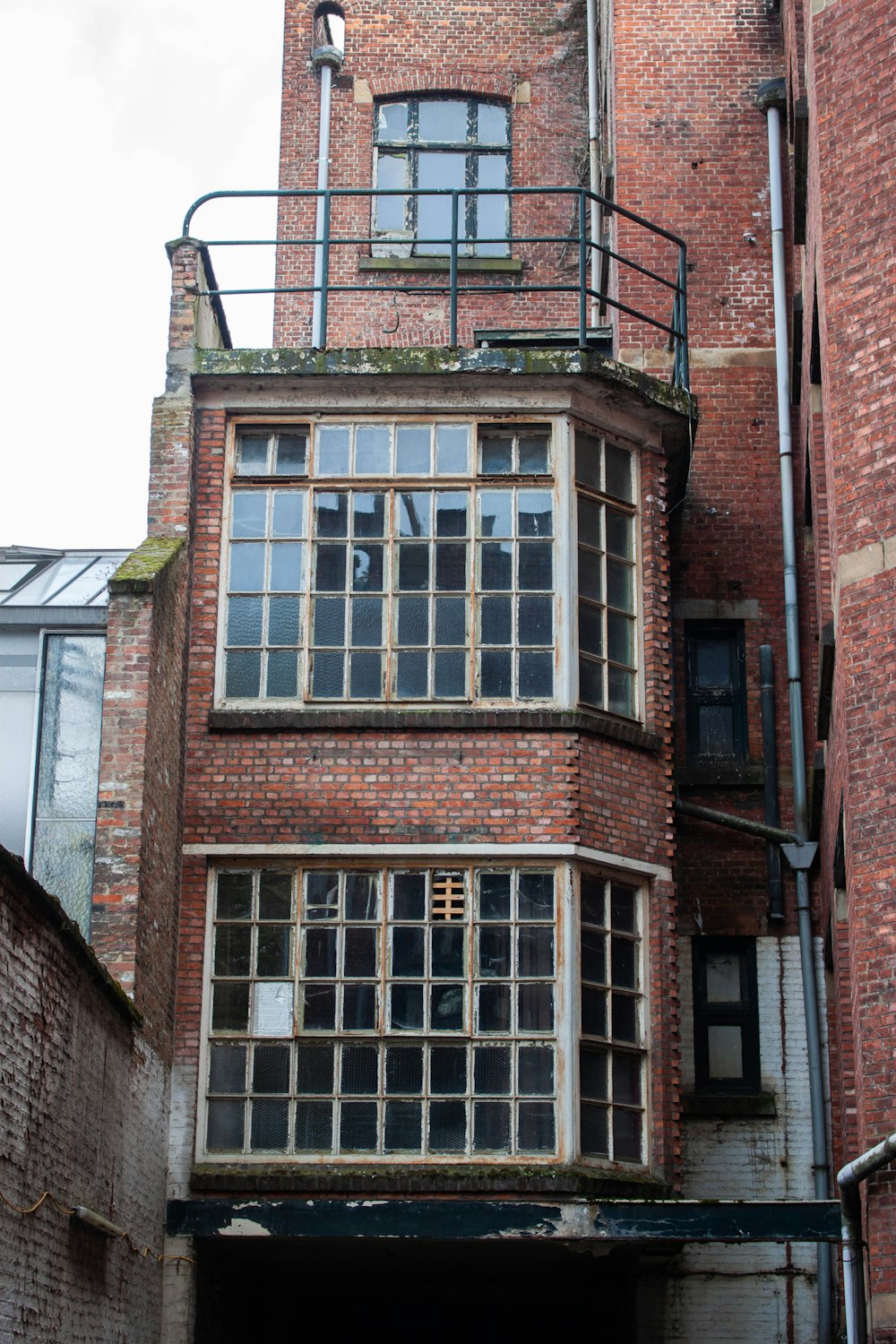 a tall brick building with lots of windows