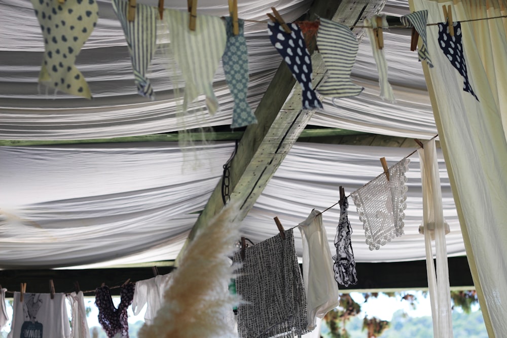 clothes hanging from a line under a canopy