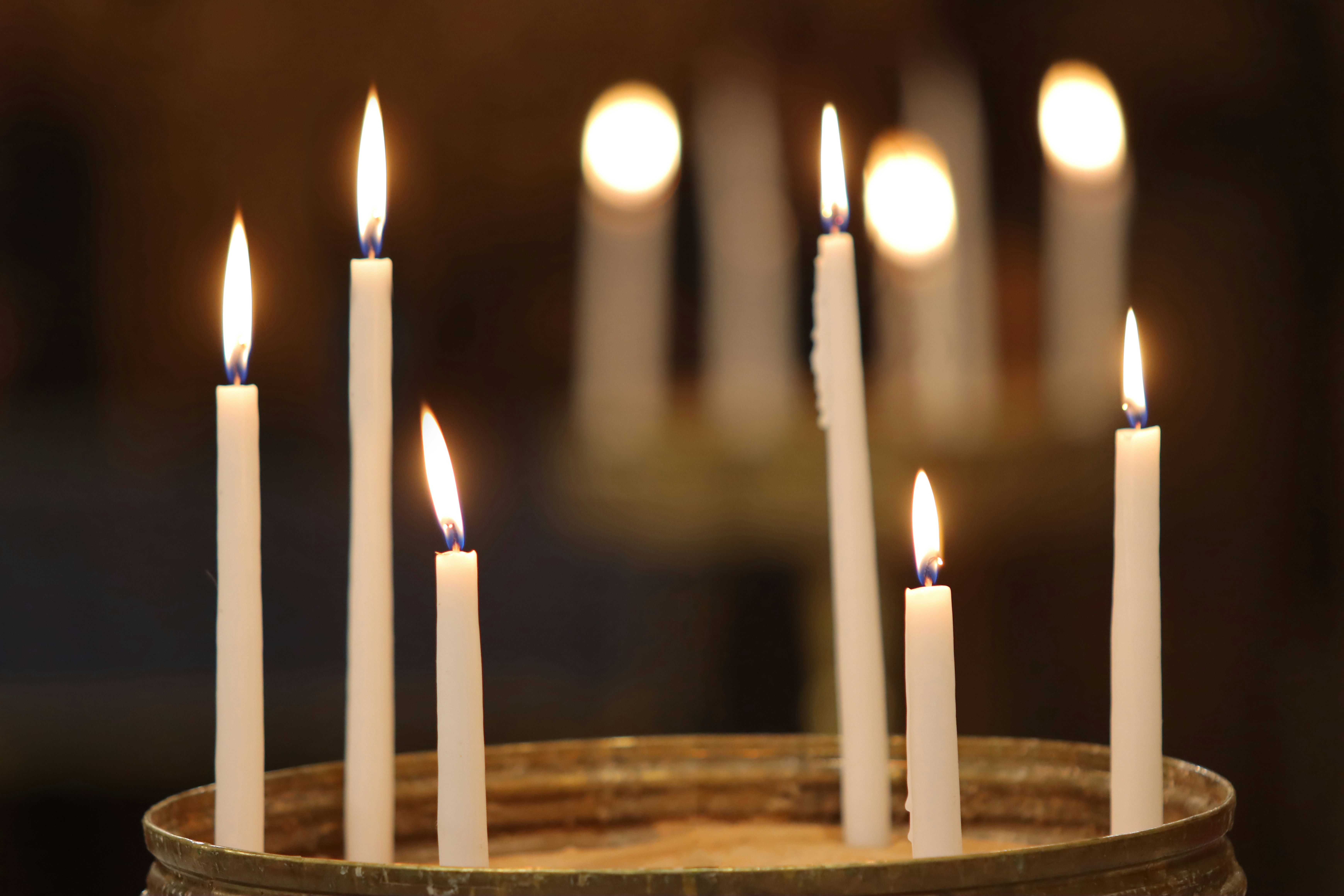 woman wearing yellow long-sleeved dress under white clouds and blue sky during daytime