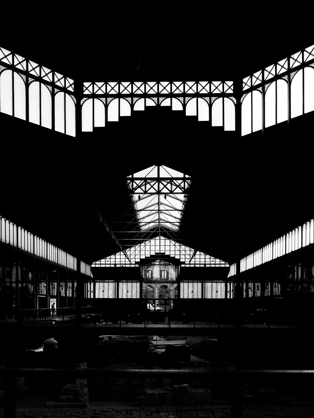 a black and white photo of a train station