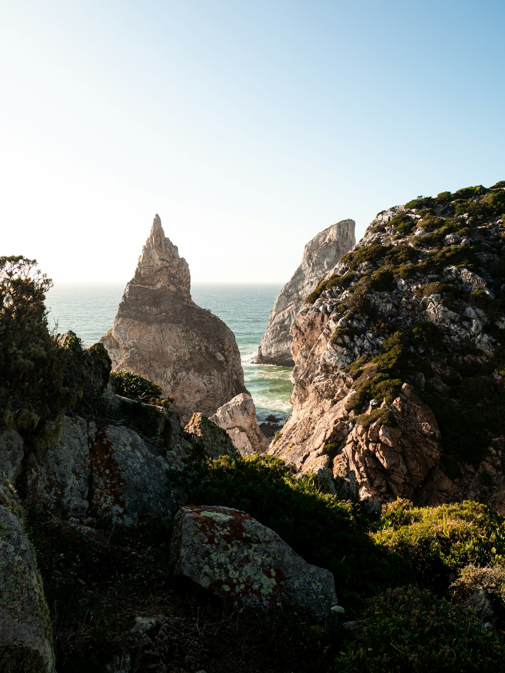 a view of the ocean from the top of a mountain