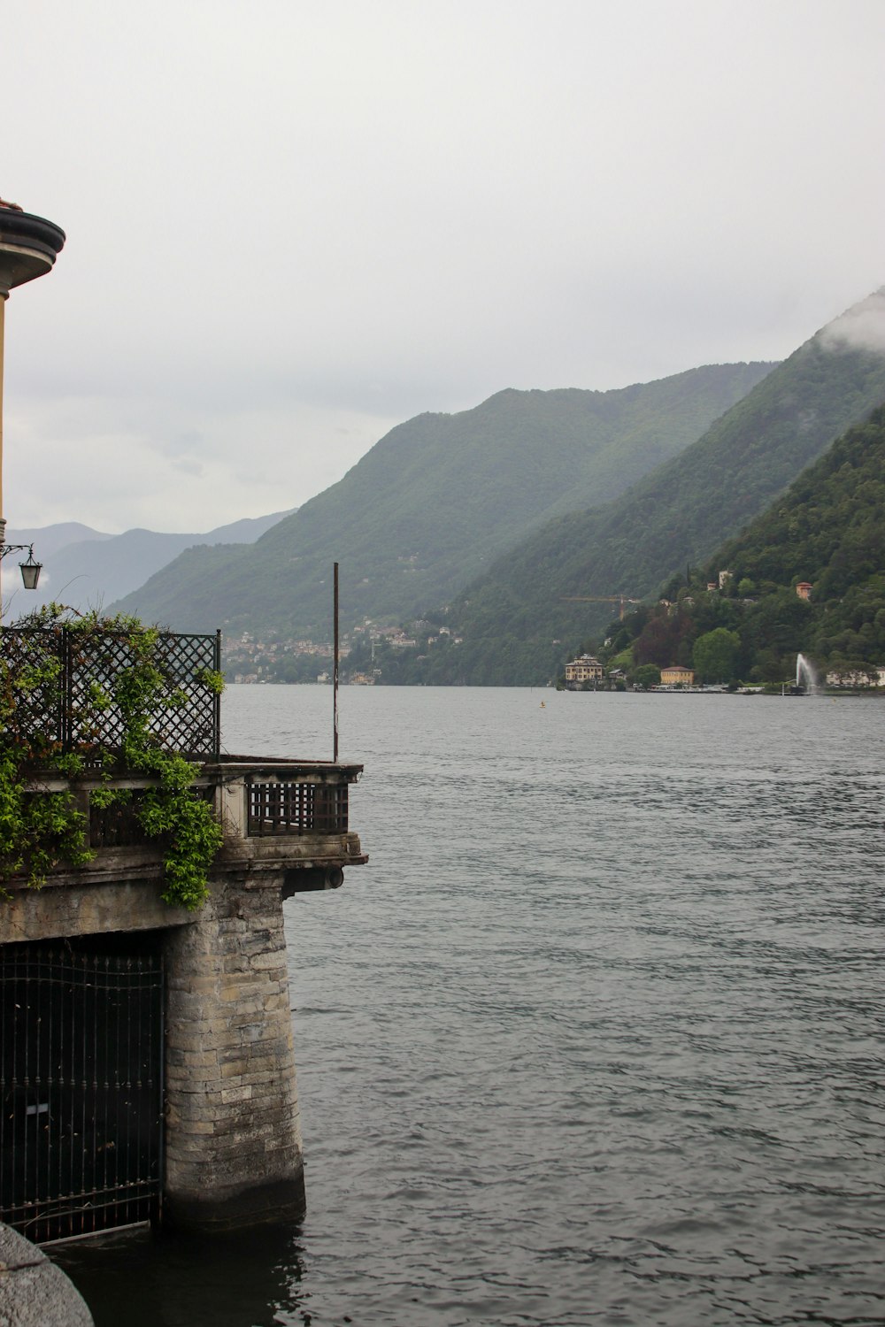 a large body of water with mountains in the background