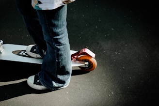 a person riding a skateboard on a street