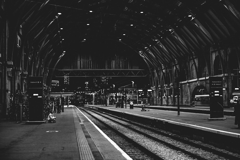 a black and white photo of a train station