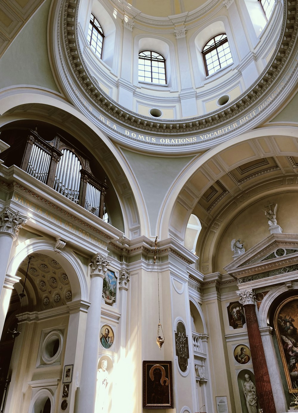 a church with a dome ceiling and a pipe organ