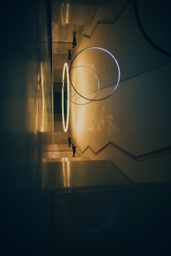 a hallway with a circular light hanging from the ceiling