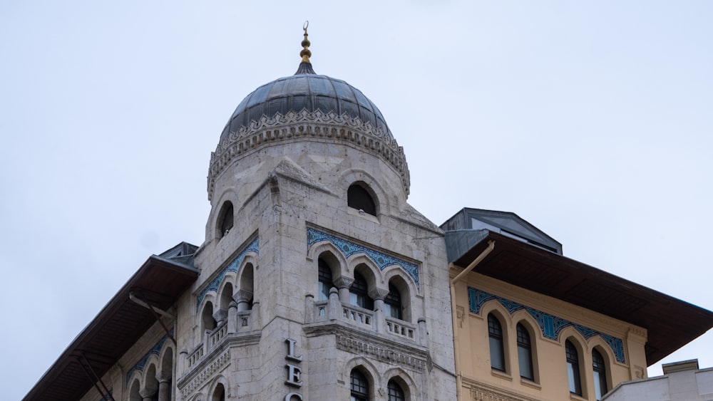 a tall building with a dome on top of it