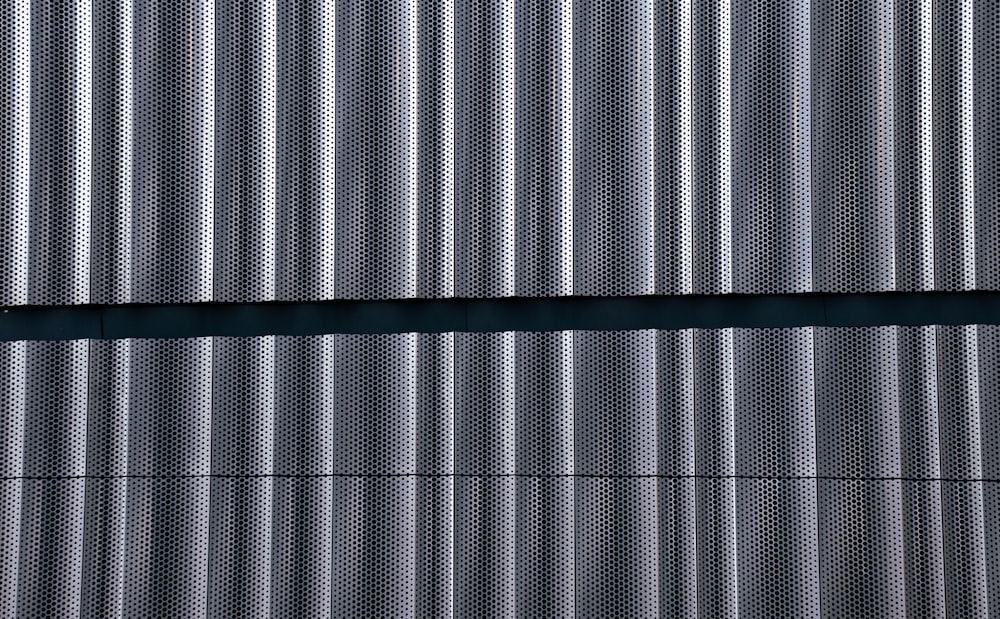 a close up of a building with a metal wall