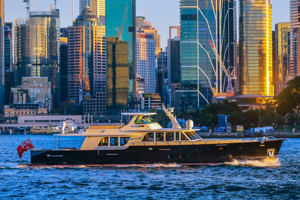 a large boat in a body of water near a city