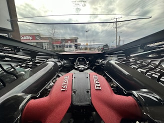 A Ferrari being serviced in a professional workshop.