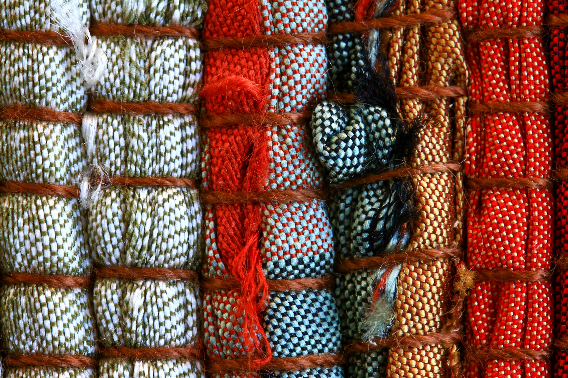 a bunch of different colors of yarn on display