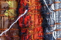 A close-up of colorful threads and fabrics.