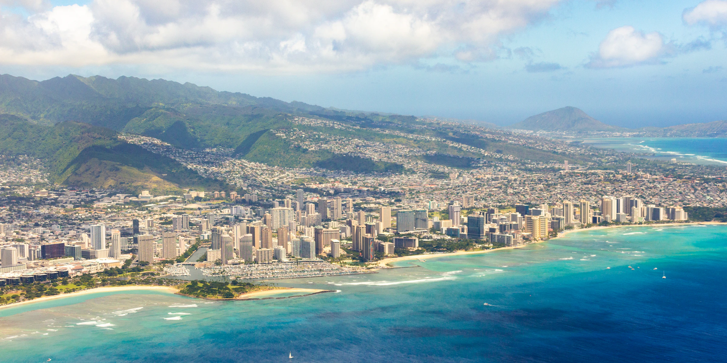Aerial view of Honolulu meeting the Pacific Ocean on O'ahu