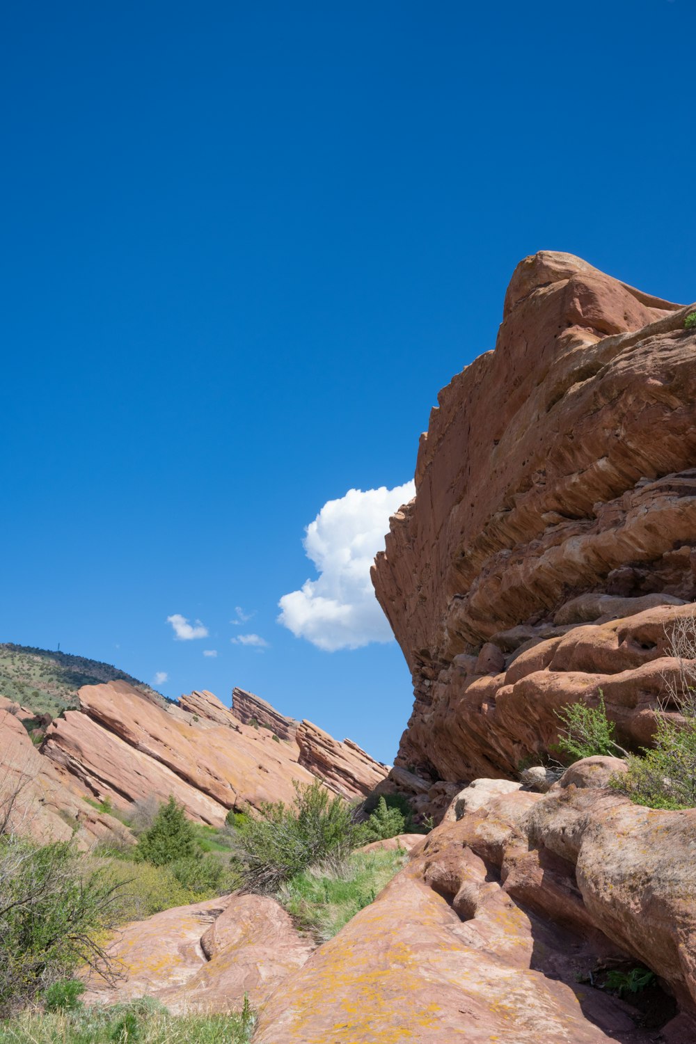 a large rock formation with a sky background