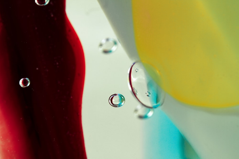 a close up of a red, yellow, and blue vase