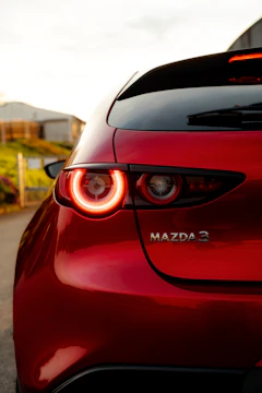 Close-up artistic shot of Mazda3’s front grille with soft natural lighting