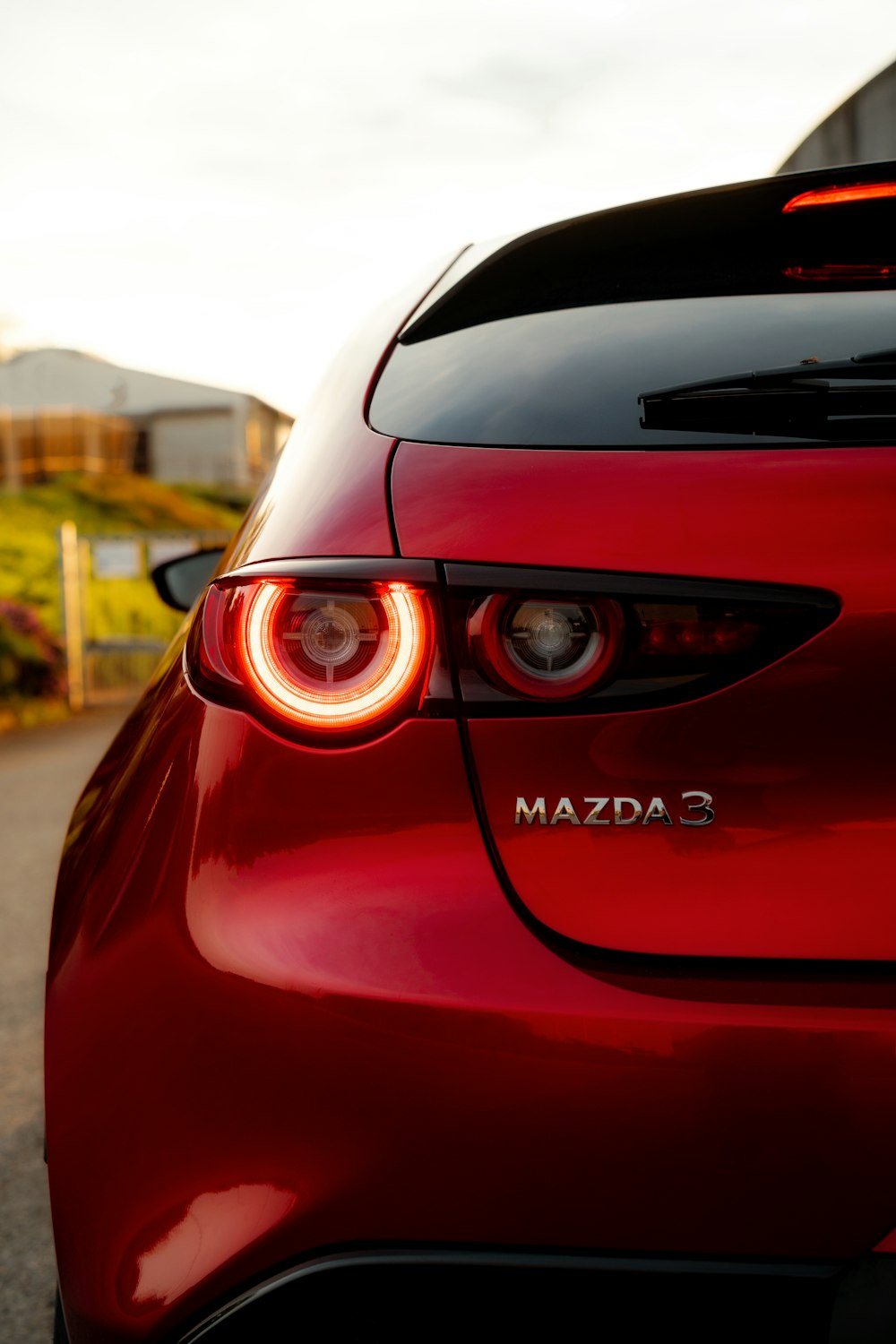 a close up of the tail lights of a red car