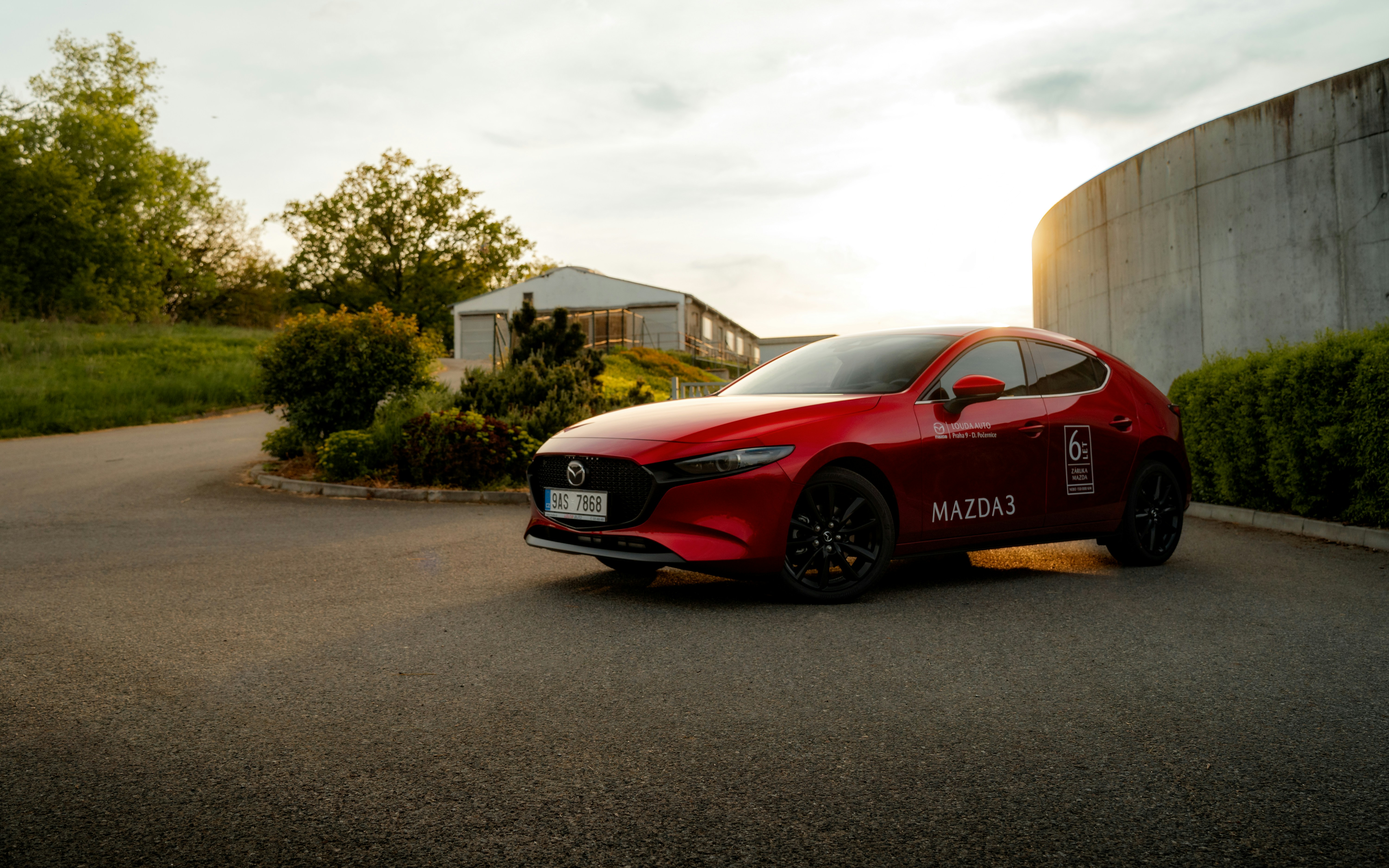 a red sports car parked in a parking lot