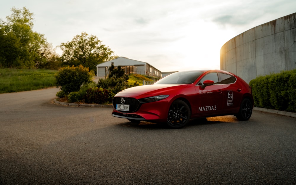 a red sports car parked in a parking lot