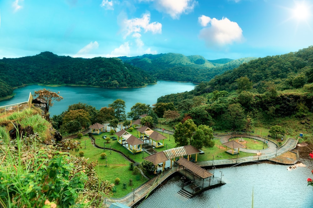 a lake surrounded by lush green hills and trees