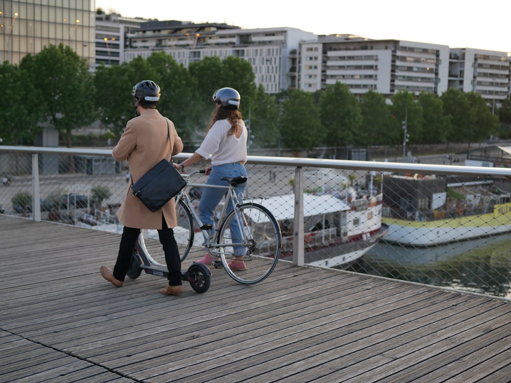 a couple of people that are on a bike