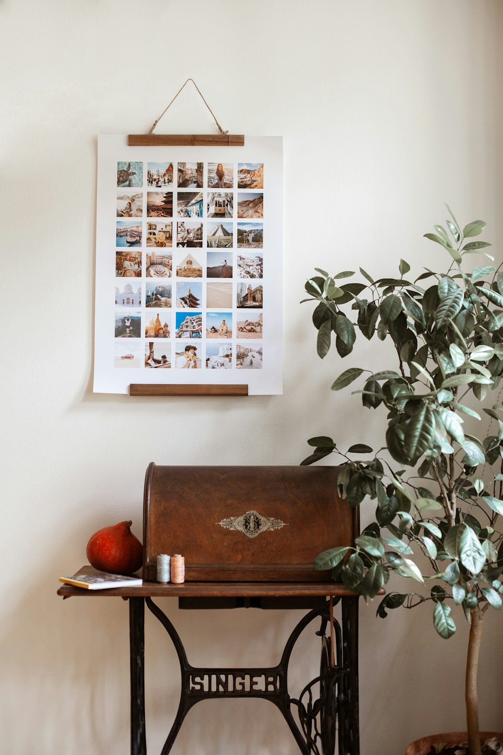 a sewing machine and a potted plant on a table