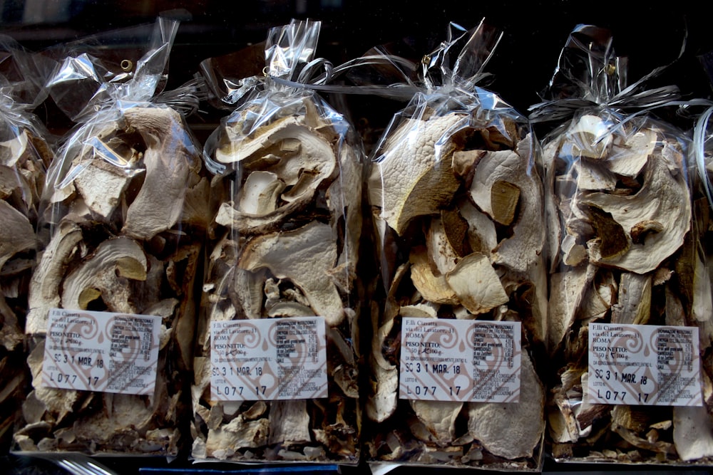 several bags of dried mushrooms are on display