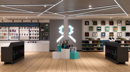 A modern retail store interior featuring shelves stocked with various merchandise including toys, figurines, and colorful boxes. The design includes sleek black counters with a gaming-themed logo, illuminated geometric light fixtures on the ceiling, and wooden flooring. Artwork and apparel are displayed on the walls, providing a vibrant and organized shopping environment.