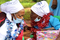 Widows receiving care packages and heartfelt conversations with community helpers.