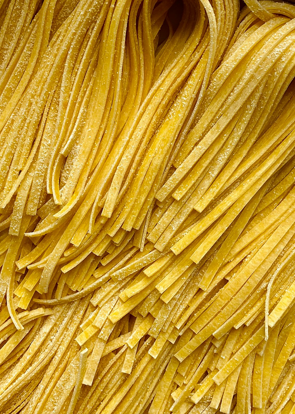 a close up of a bunch of yellow pasta