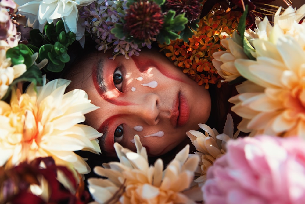 a woman with flowers around her head