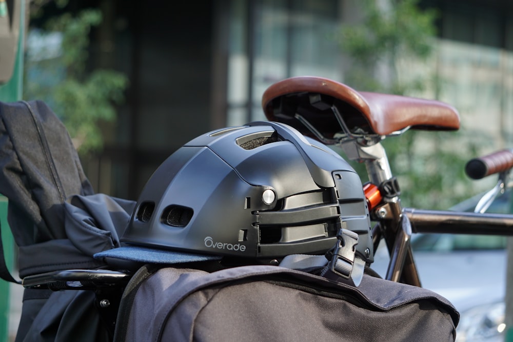 a helmet is sitting on top of a bicycle