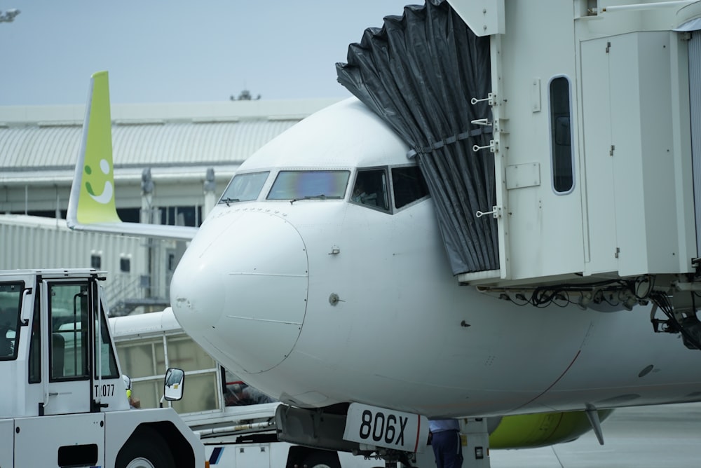 a large jetliner sitting on top of an airport tarmac