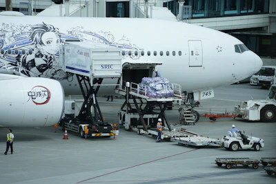 A Multimex cargo plane being loaded for international shipment on the tarmac.