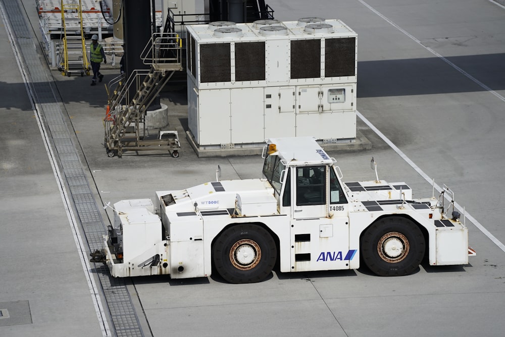 a large white truck parked on top of a tarmac